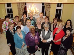 Thandi  surrounded  by  guests  at  Moira’s  home.  To  Thandi’s  left   is  Margaret  Crawford,  All  Ireland  President.